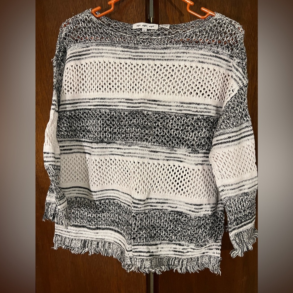 Black and white crochet three-quarter sleeve sweater